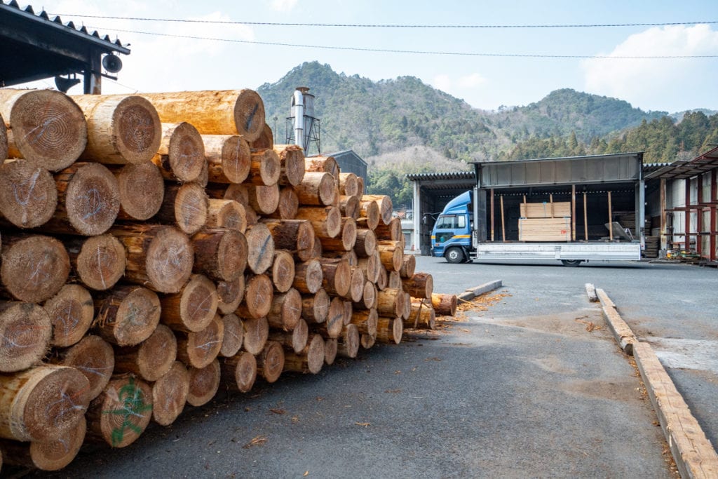 Sustainably harvested sugi logs being prepared for milling and burning at our Hiroshima mill facility.  